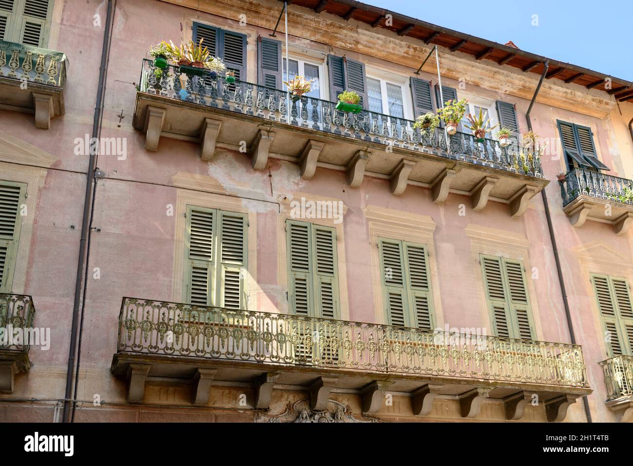 detail of iron railings on balconies of old house in village of ...