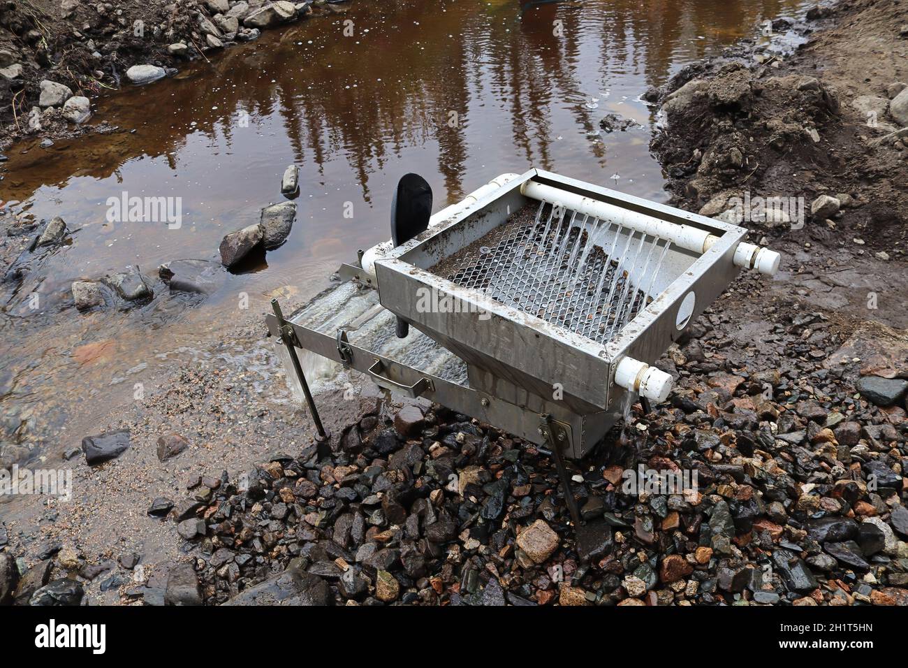 Sluce view of a sluce setup for extracting gold in a river. Stock Photo