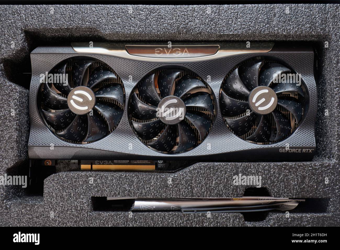 Budapest, Hungary - Circa 2020: Nvidia Geforce RTX 3090 Graphics Card manufactured by EVGA unboxed on a desk. Model: EVGA Geforce RTX 3090 FTW3 Ultra, Stock Photo