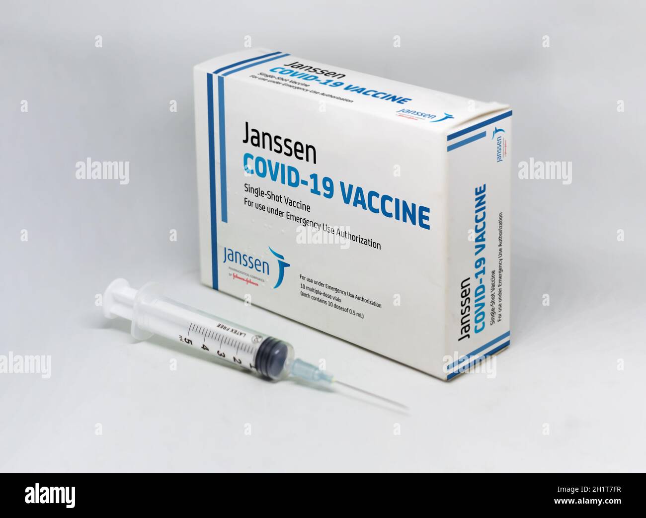 New York, USA, April 12th 2021: A syringe next to the Janssen Covid-19 vaccine box. Janssen is a subsiadiary company of Johnson and Johnson and devolo Stock Photo