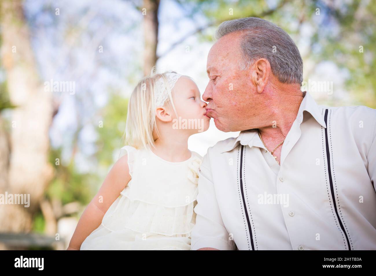 Granddaughter kissing grandfather hi-res stock photography and images -  Alamy