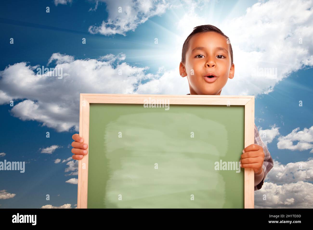 boy at blank chalkboard