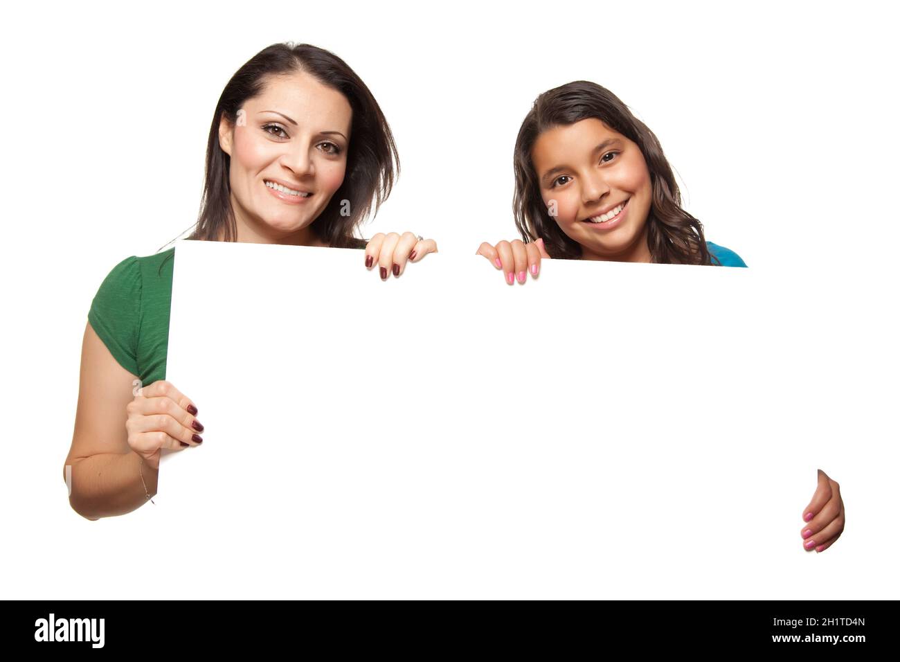 Pretty Hispanic Girl and Mother Holding Blank Board Isolated on a White Background. Stock Photo