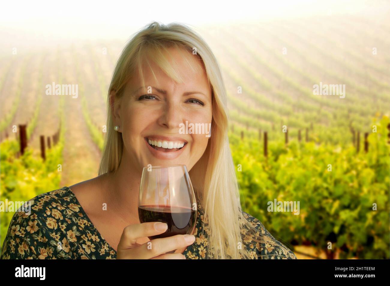 Happy Attractive Woman Enjoying a Glass of Wine at the Vineyard Stock ...