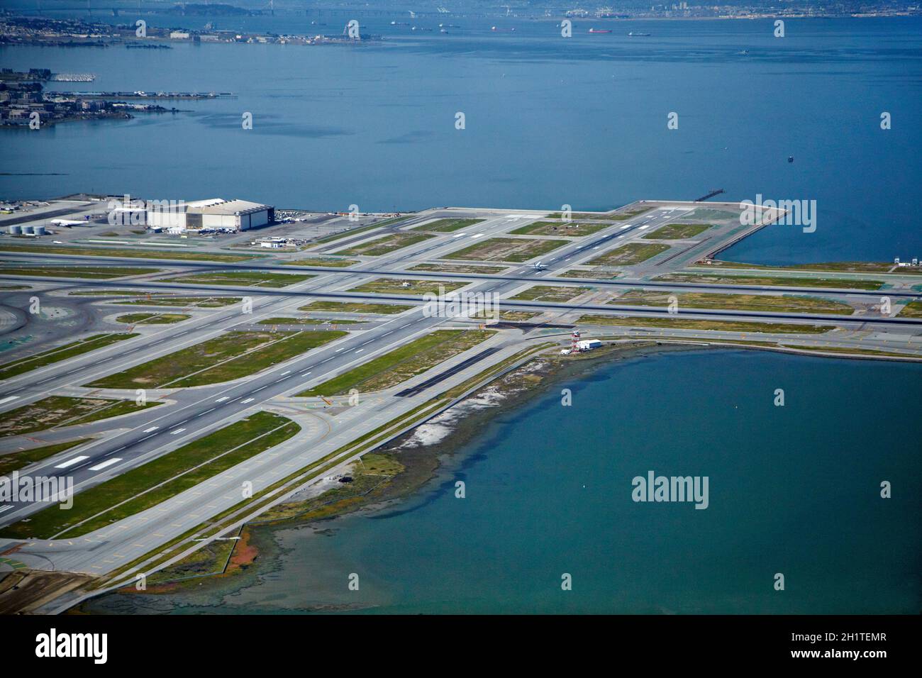 Runways, San Francisco International Airport, and San Francisco Bay, San Francisco, California, USA - aerial Stock Photo