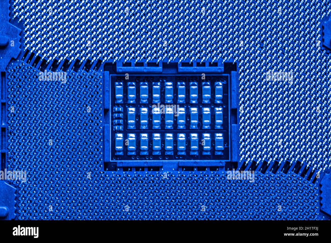 Detail of a Cpu socket in a motherboard of a gaming pc in bluie light ...
