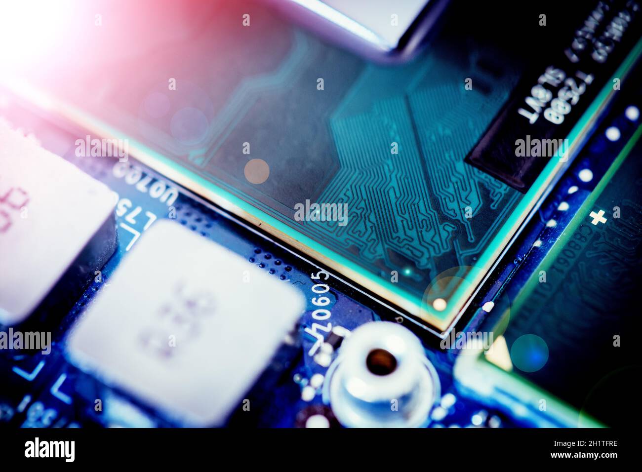 Computer chip on a circuit board, close up with light effect. Computer ...