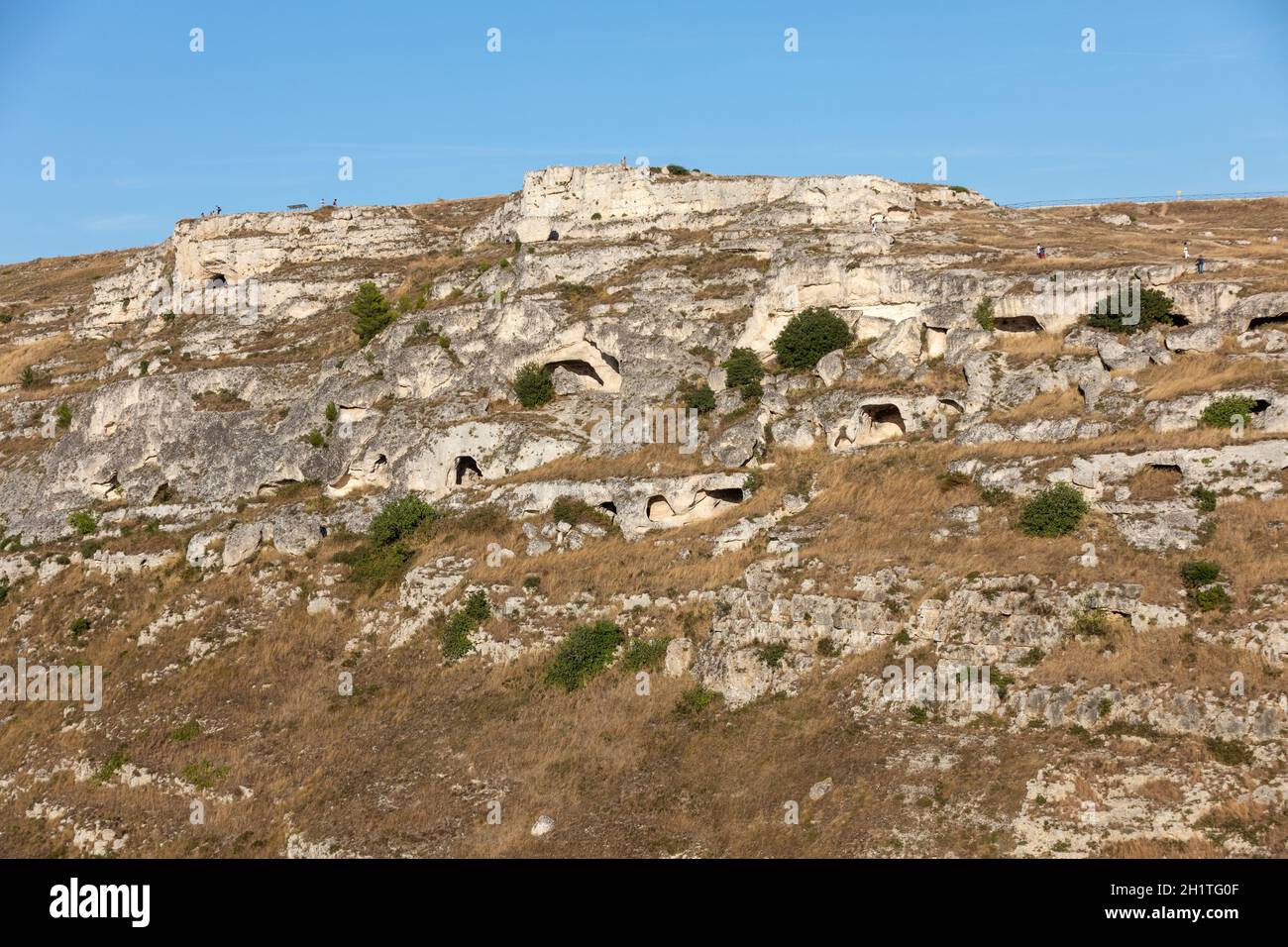 View of Gravina river canyon and park of the Rupestrian Churches of Matera with houses in caves di Murgia Timone near ancient town Matera (Sassi), , B Stock Photo