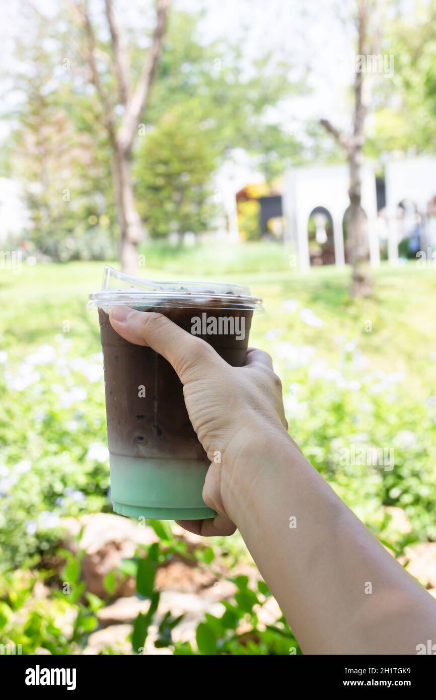 Female hand holding iced coffee hi-res stock photography and images - Alamy
