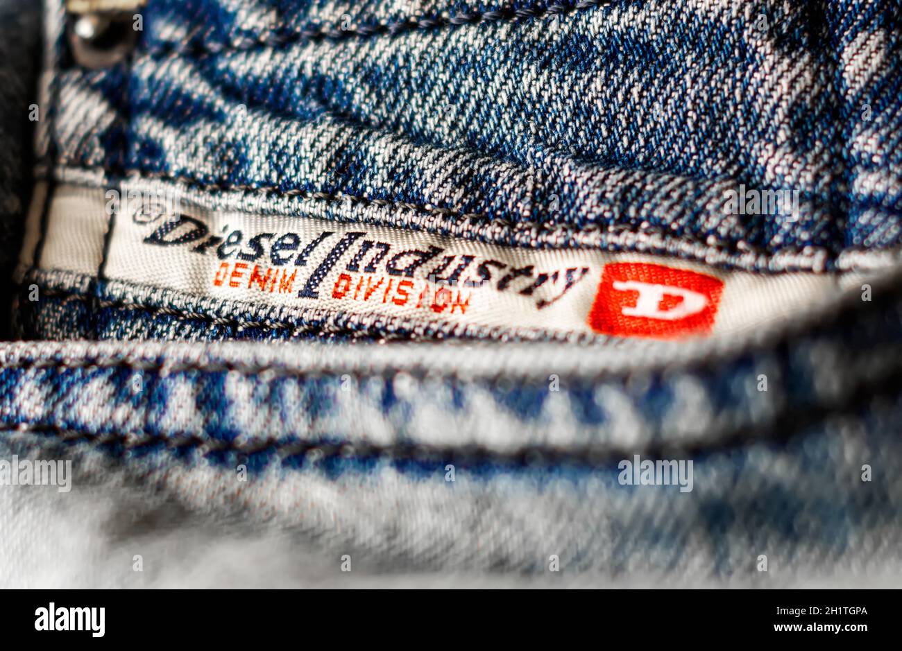 Rome, Italy, April 2021: Detail of the Diesel Industry logo sewn on the  front pocket of a pair of jeans trousers. Diesel is an Italian fashion  multina Stock Photo - Alamy