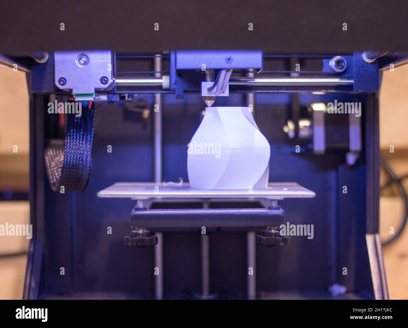 Automatic 3d printer performs a three-dimensional product creation, close-up Stock Photo