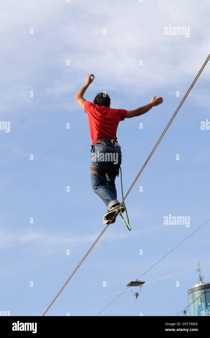 slacklining or walking on a tightrope, balancing on a rope Stock Photo