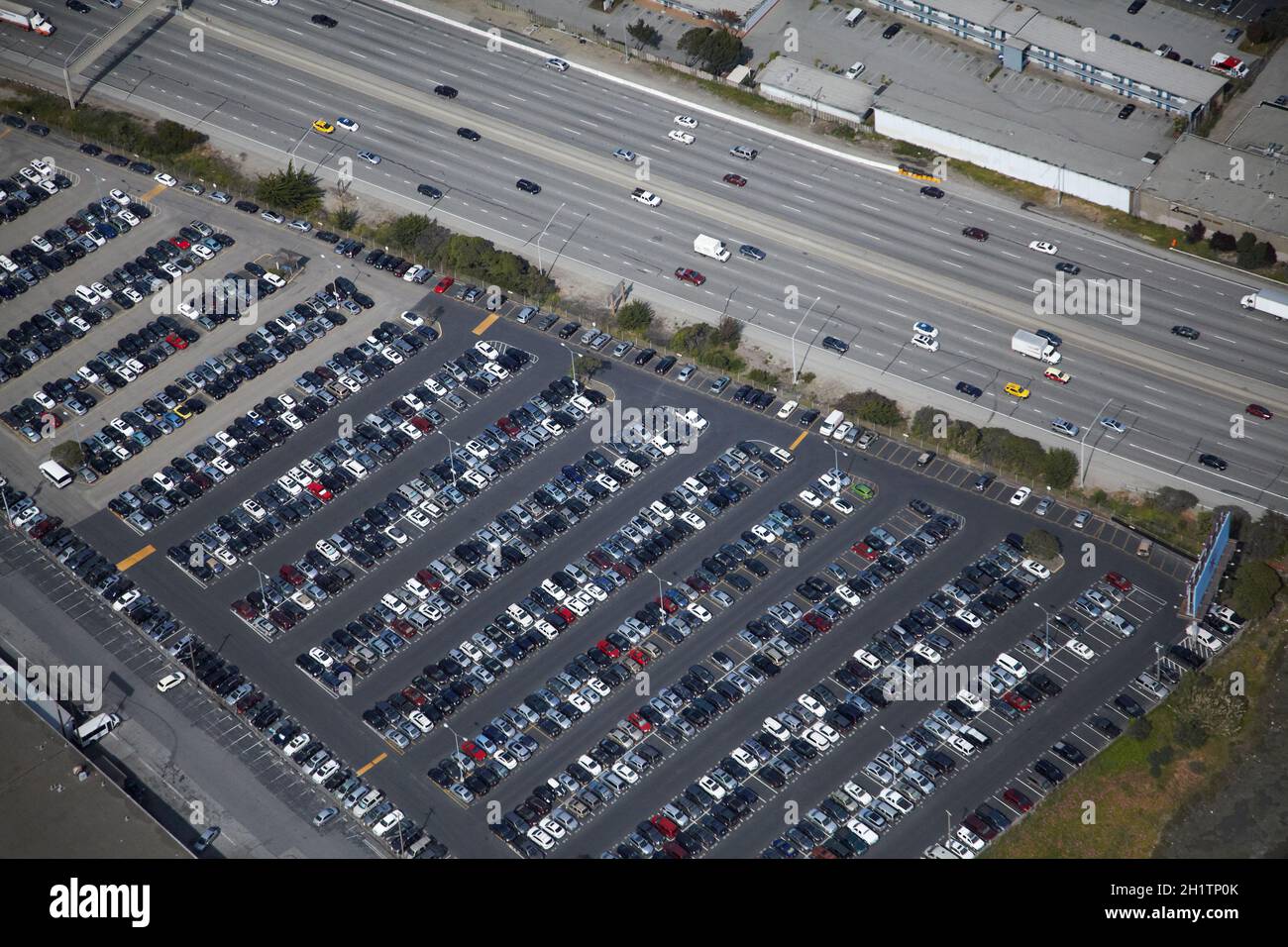 Car park by US 101 freeway, near San Francisco Airport, San Francisco, California, USA - aerial. Stock Photo