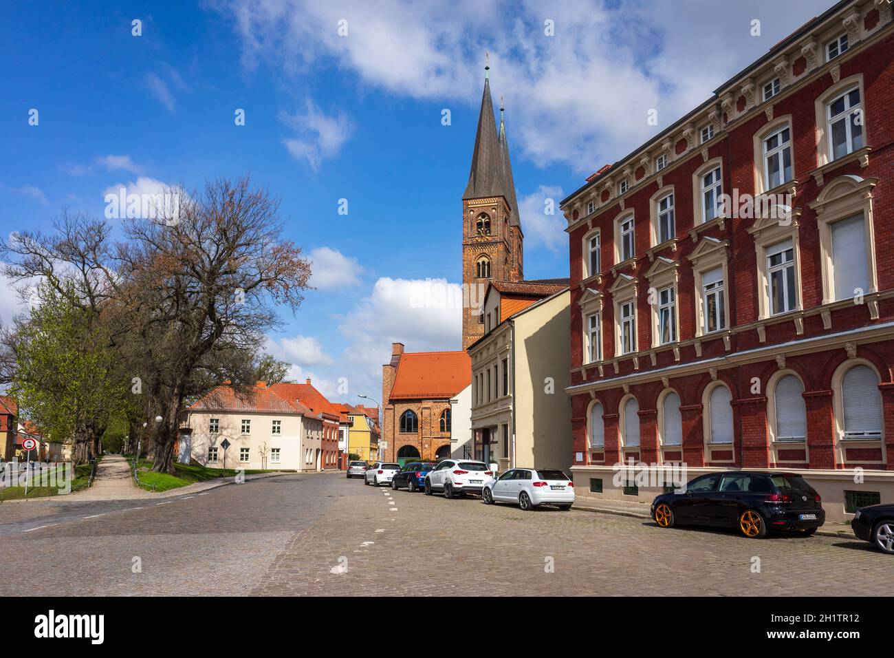 STENDAL, GERMANY - APRIL 24, 2021: Houses and buildings on the streets in the old town. In the background St. Nicholas Church. Hansestadt Stendal is a Stock Photo