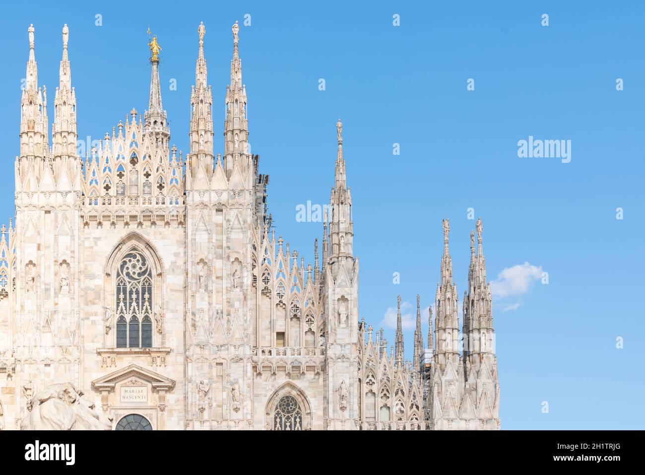 Details of Duomo with the golden statue name "Madonnina" on the top of