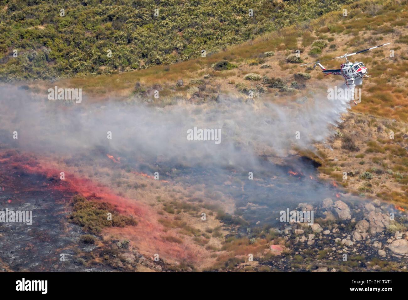Winchester, CA USA June 14, 2020 Cal Fire helicopter drops water on