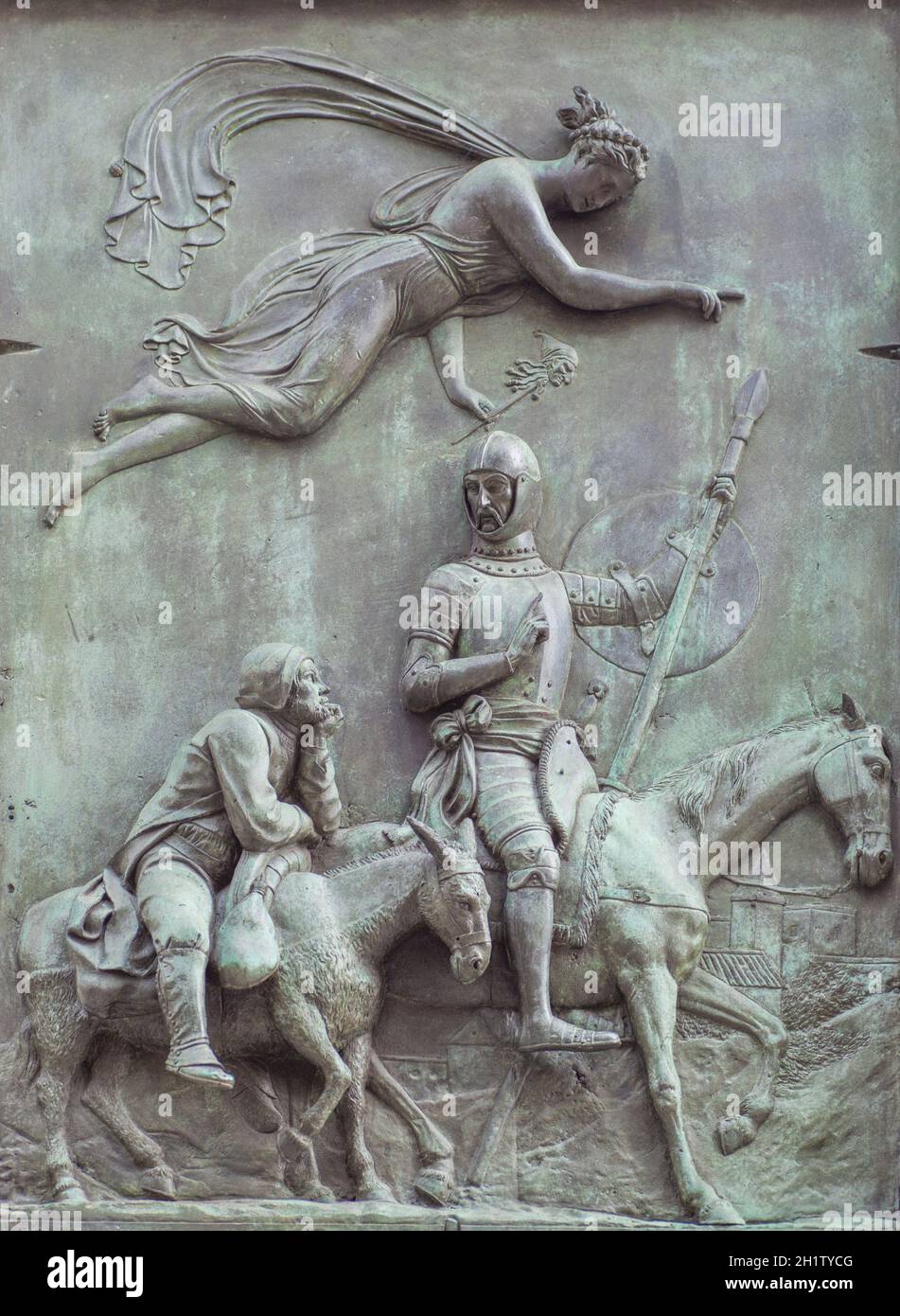 Spain, Madrid - March 6th, 2021: Bronze reliefs with Don Quixote scene. By Jose Piquer Duart, 1835. Don Quixote and Sancho Panza driven by the goddess Stock Photo