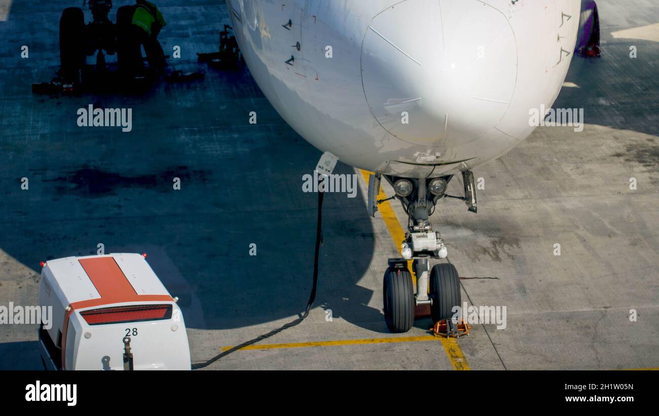 Charging airplane batteries during ground maintenance in airport Stock