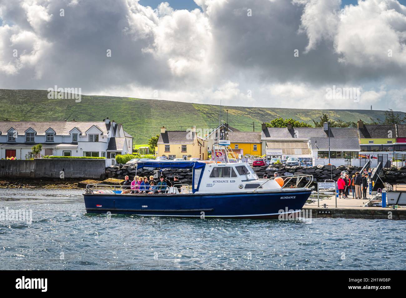 Portmagee, Ireland, August 2019 Group of tourists boarding a cruise boat to visit Skellig Michael island where Star Wars were filmed, Ring of Kerry Stock Photo