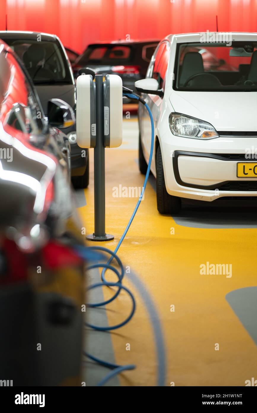 Electric car charging Stock Photo - Alamy