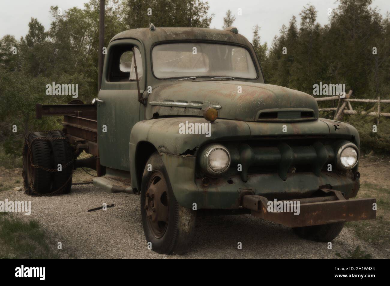 A vintage composition of an old truck parked in a field Stock Photo - Alamy