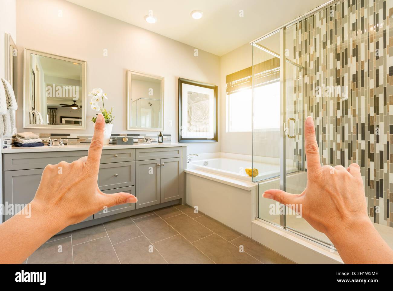 Hands Framing Custom Master Bathroom Interior. Stock Photo