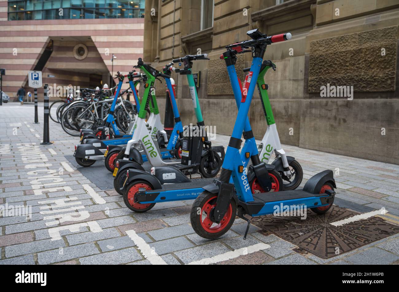 Lime and Dott rental trial electric scooters parked in Bucklersbury