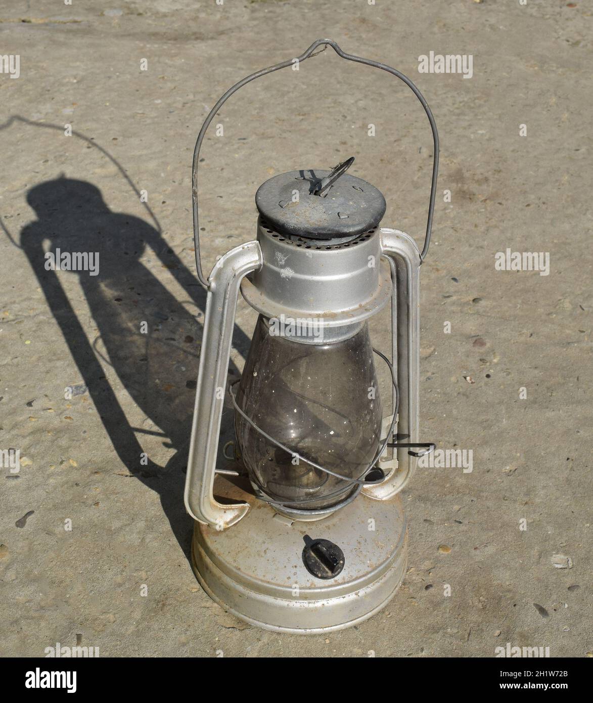 Old kerosene lamp. The old lighting fixture. Stock Photo