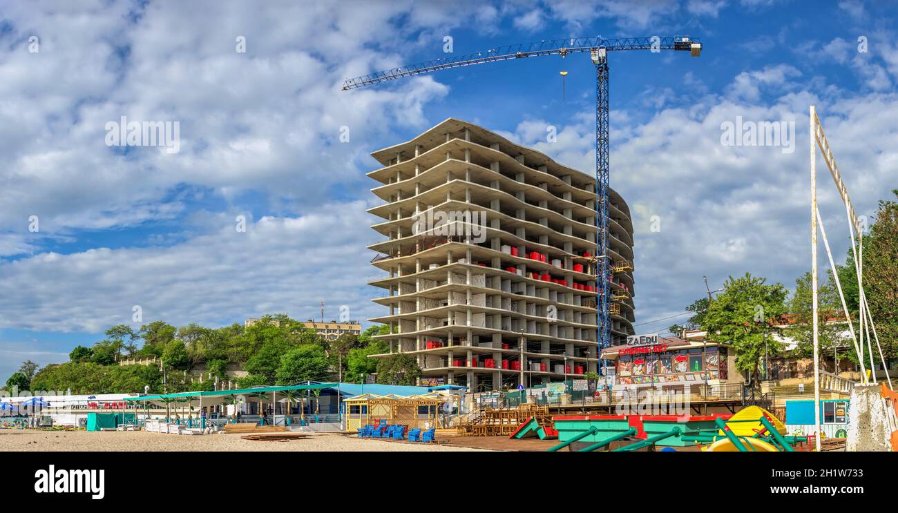 01.06.2021. Illegal construction of a residential building on the public beach Zolotoy Bereg in Odessa, Ukraine, on a sunny summer morning Stock Photo