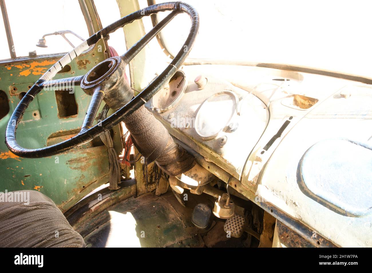 Interior of a driver's cab of an old abandoned and damaged vintage truck Stock Photo