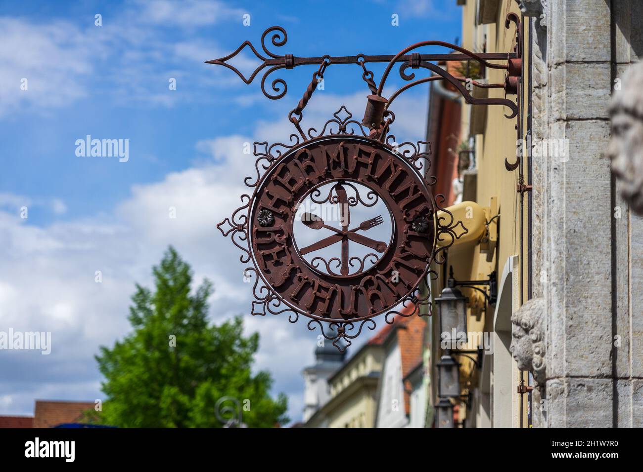 JUETERBOG, GERMANY - MAY 23, 2021: Beautiful wrought iron sign 'Hermanns Restaurant' in old town. Juterbog is a historic town in north-eastern Germany Stock Photo