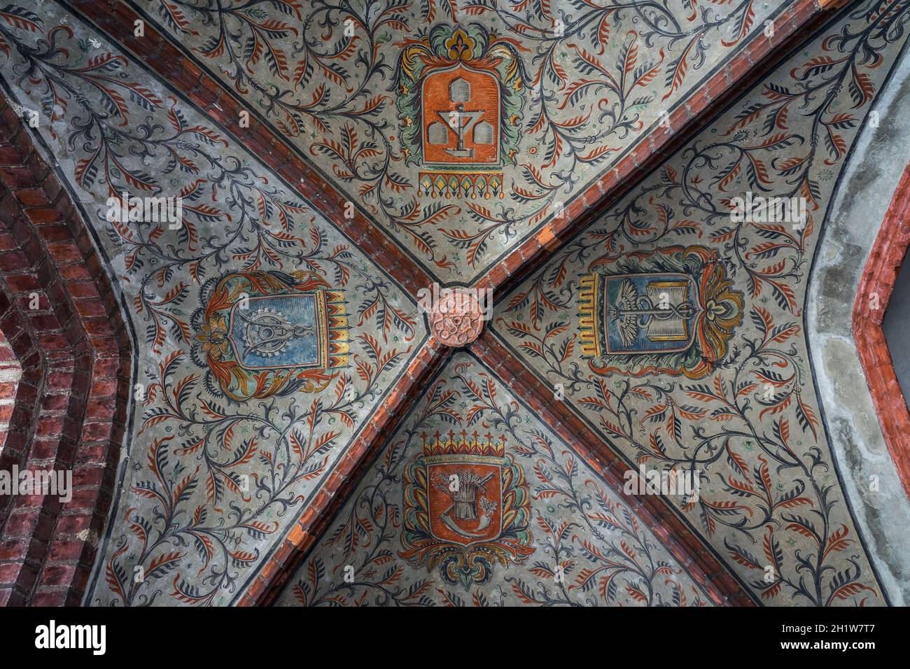 JUETERBOG, GERMANY - MAY 23, 2021: Beautiful ceiling with the coats of arms of the various symbols in the town hall building. Stock Photo