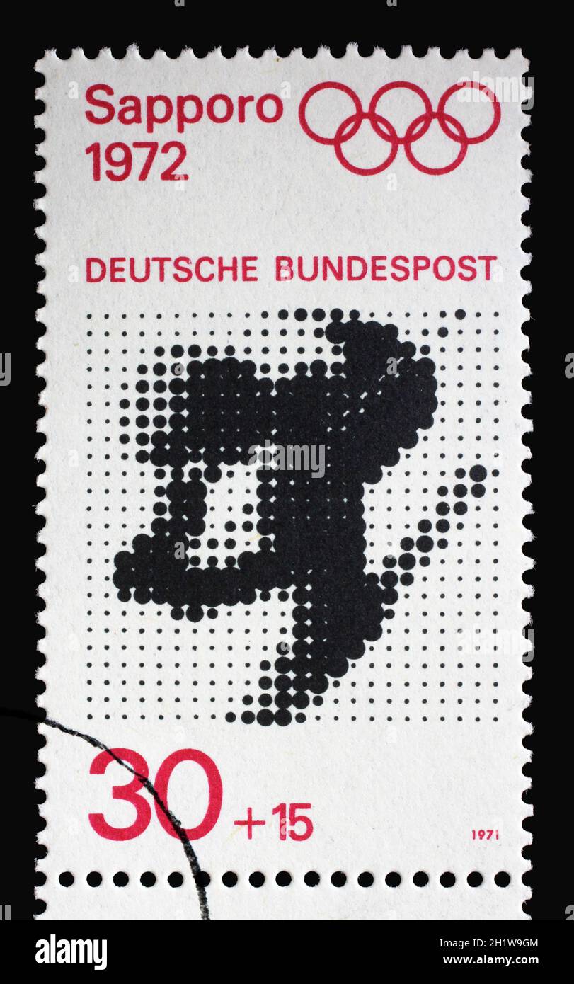 Stamp printed in Germany shows Downhill Skiing, Winter Olympic Games Sapporo 1972, circa 1971 Stock Photo
