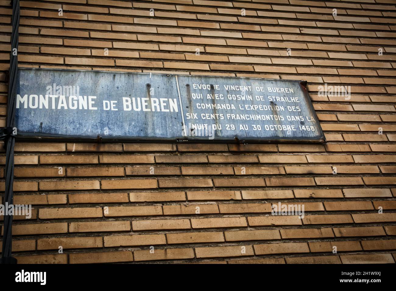 Liege, Belgium, June 2021: Street sign of Montagne de Bueren in Liege on a brick wall. Close-up and detail. Stock Photo