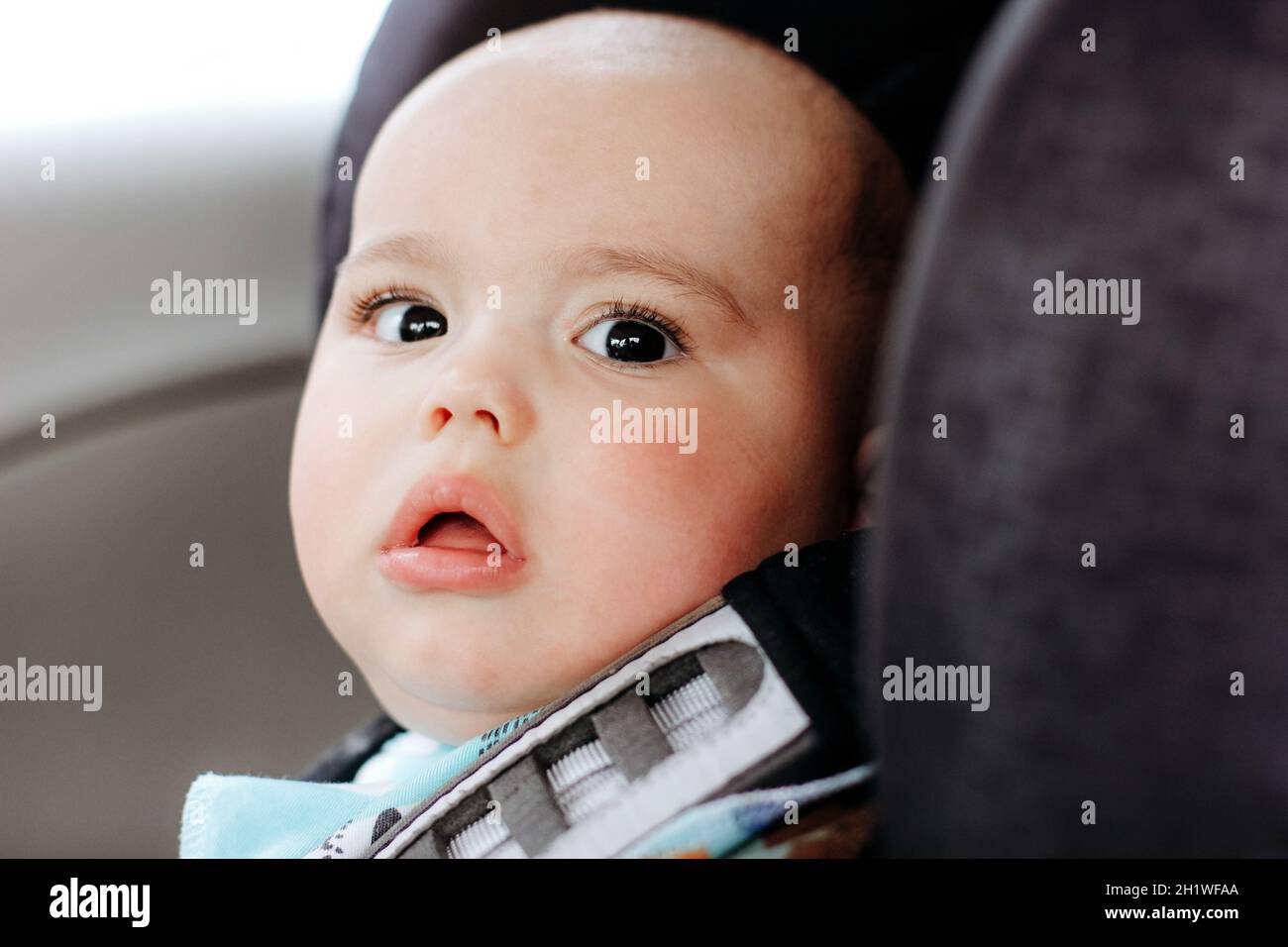 Sweet infant in the car sits in child seat. Safe driving. Baby care Stock Photo Alamy