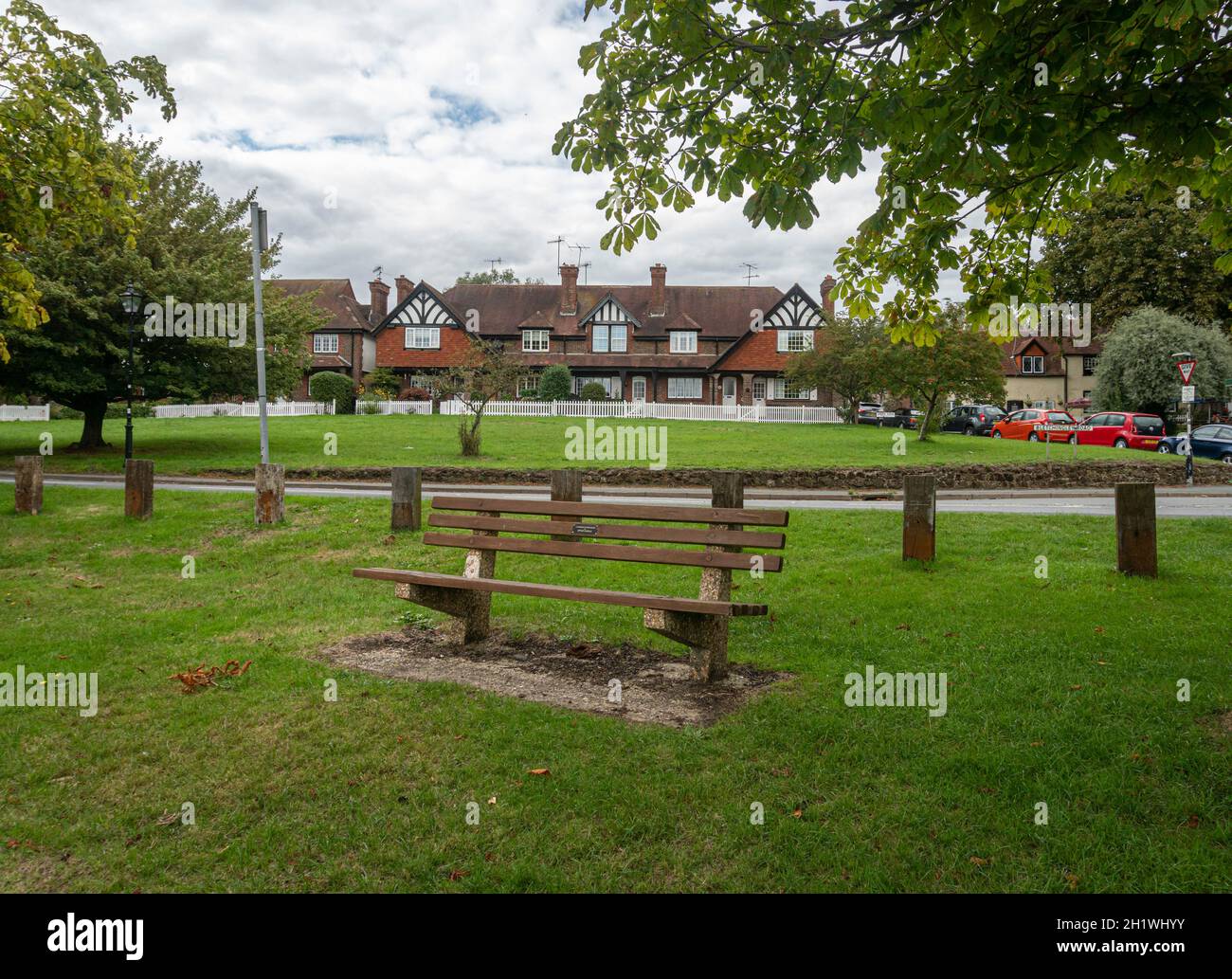 A wooden bench on Godstone Green, Godstone, Surrey Stock Photo