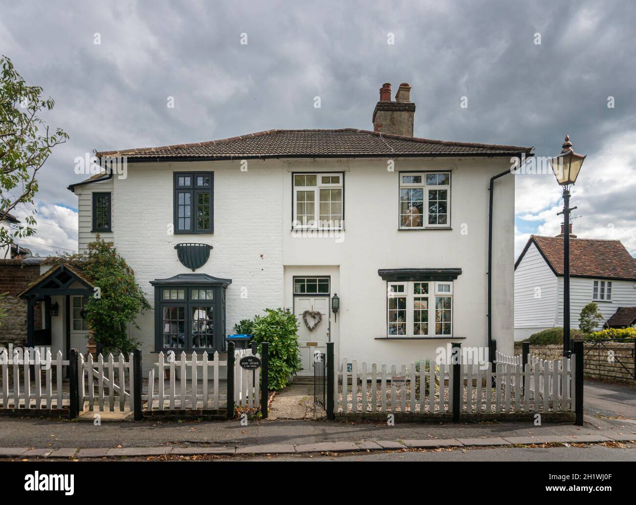 A white cottage in the village of Godstone, Surrey, UK Stock Photo