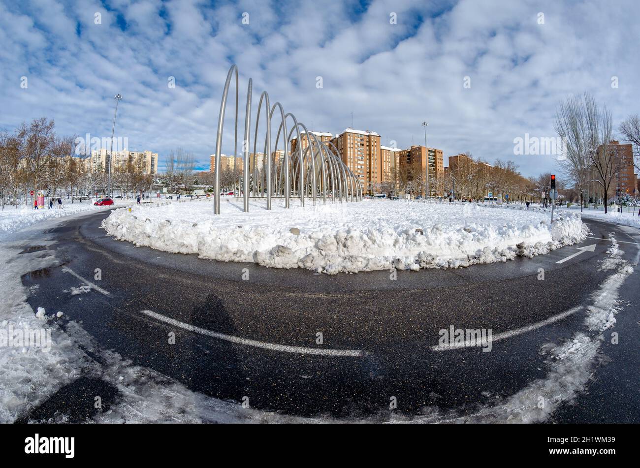 MADRID, SPAIN – JANUARY 10, 2021: View of the urban sculpture designed by Andreu Alfaro, called “Puerta de la Ilustracion”, after Storm “Filomena”, th Stock Photo