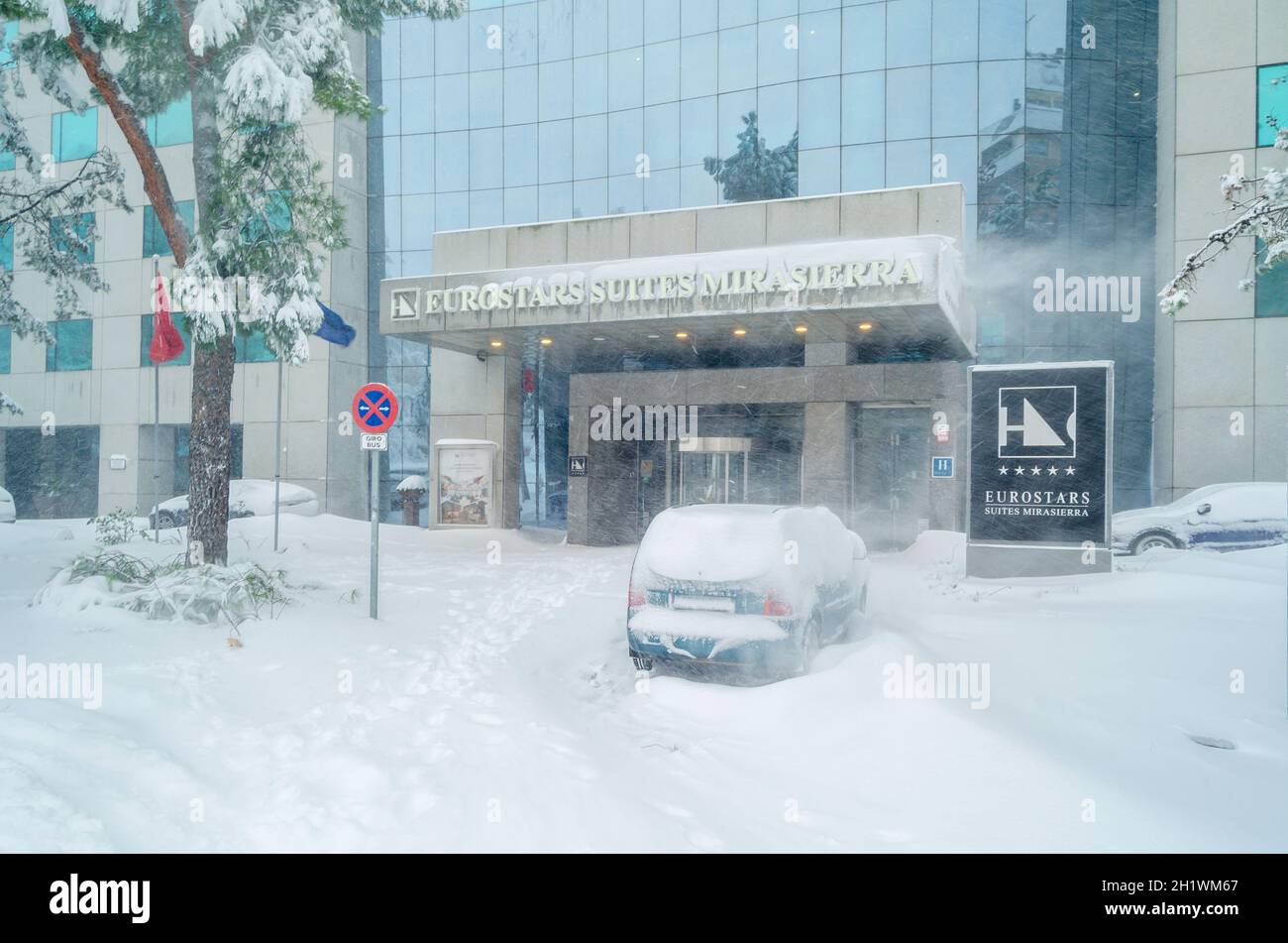 MADRID, SPAIN – JANUARY 9, 2021: Eurostars Suites Mirasierra Hotel seen during Storm “Filomena”, the heaviest snowfall in 50 years in Madrid, Spain Stock Photo