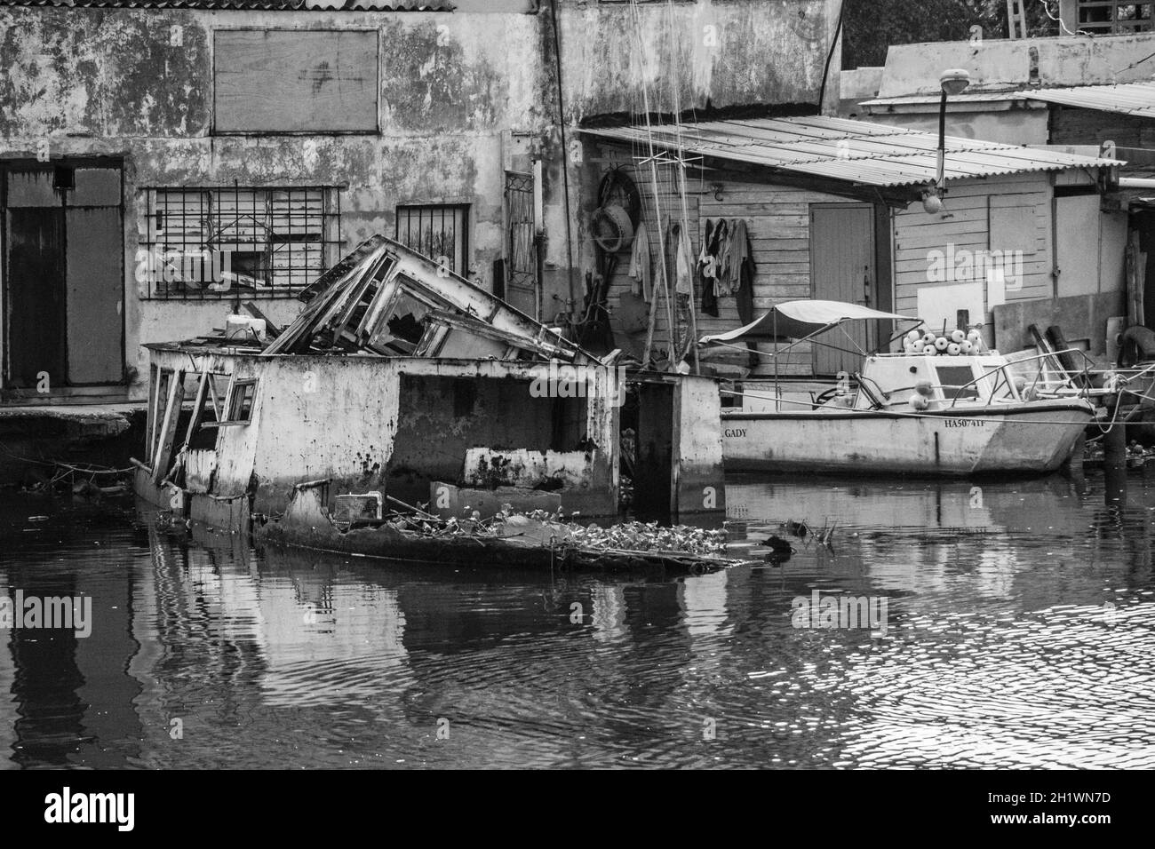 HABANA, CUBA - Aug 13, 2017: A grayscale scenery of in the  fishing boats in a port in Rio de Jaimanitas, Cuba Stock Photo
