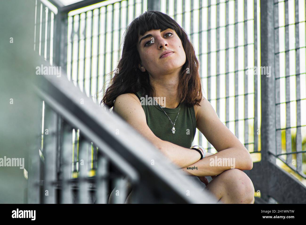 Sad girl sitting on stairs hi-res stock photography and images - Alamy