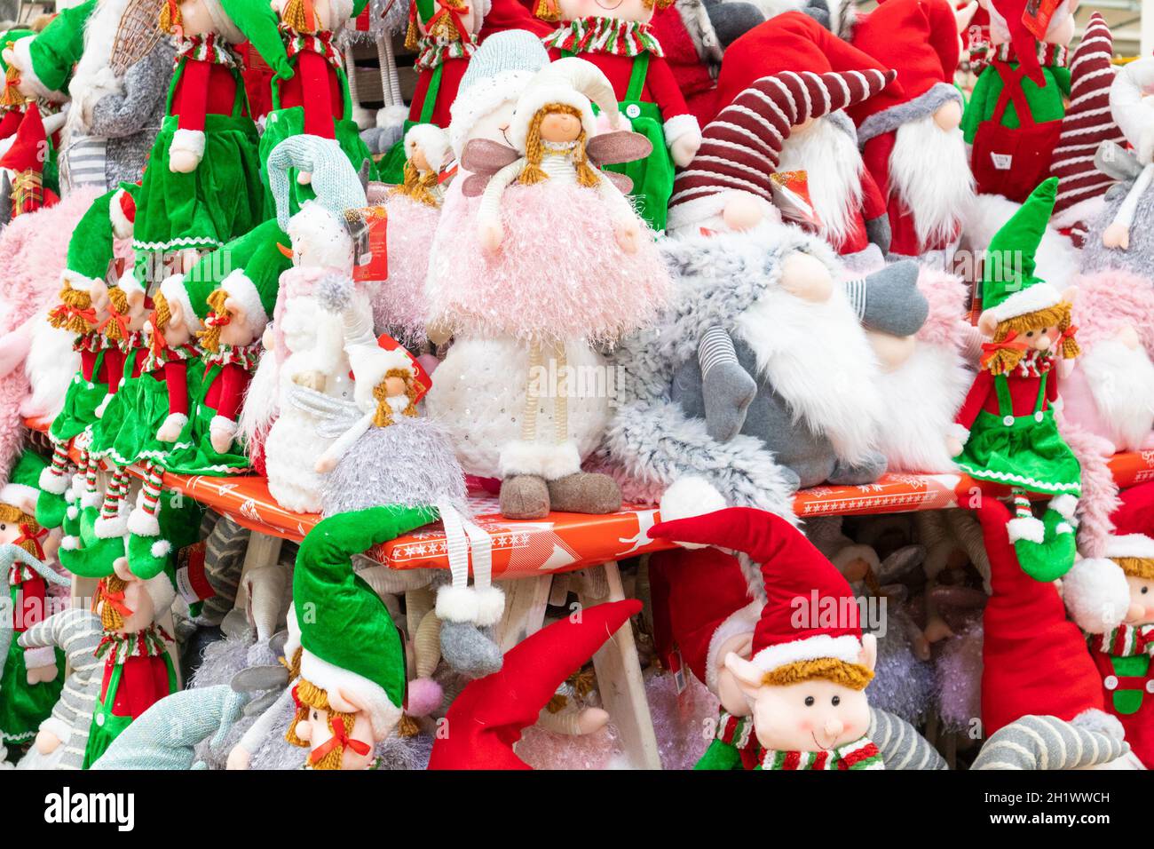 Santa Elf Store Christmas elves and santas on display at a uk store Stock Photo - Alamy