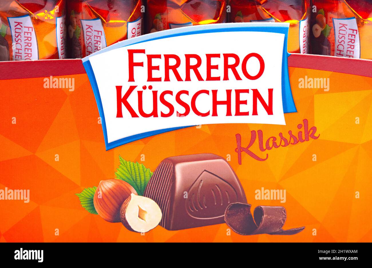 HUETTENBERG, GERMANY - 2021-07-24,   Box of Ferrero Kuesschen chocolates Logo in Detail. Ferrero is an Italian manufacturer of branded chocolate and c Stock Photo