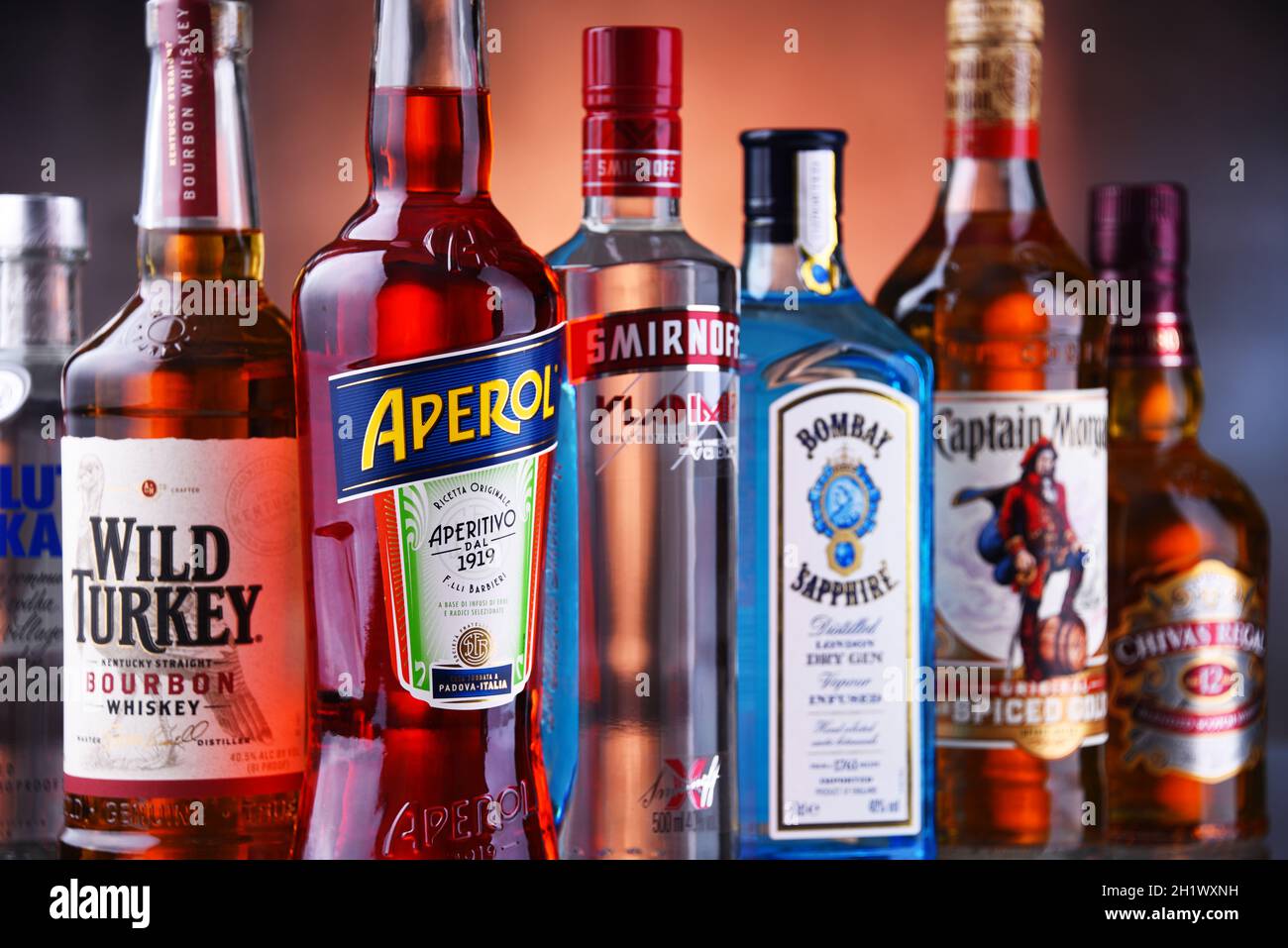POZNAN, POL - MAY 12, 2021: Bottles of assorted global hard  liquor brands including whiskey, vodka, tequila and gin Stock Photo