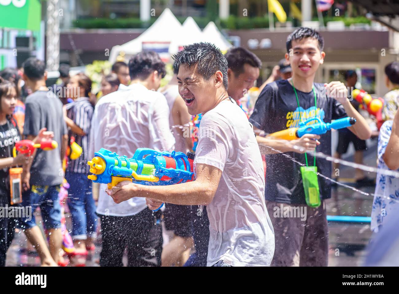 Siam Square, Bangkok, Thailand - APR 13, 2019: short action of people joins celebrations of the Thai New Year or Songkran in Siam Square. Stock Photo