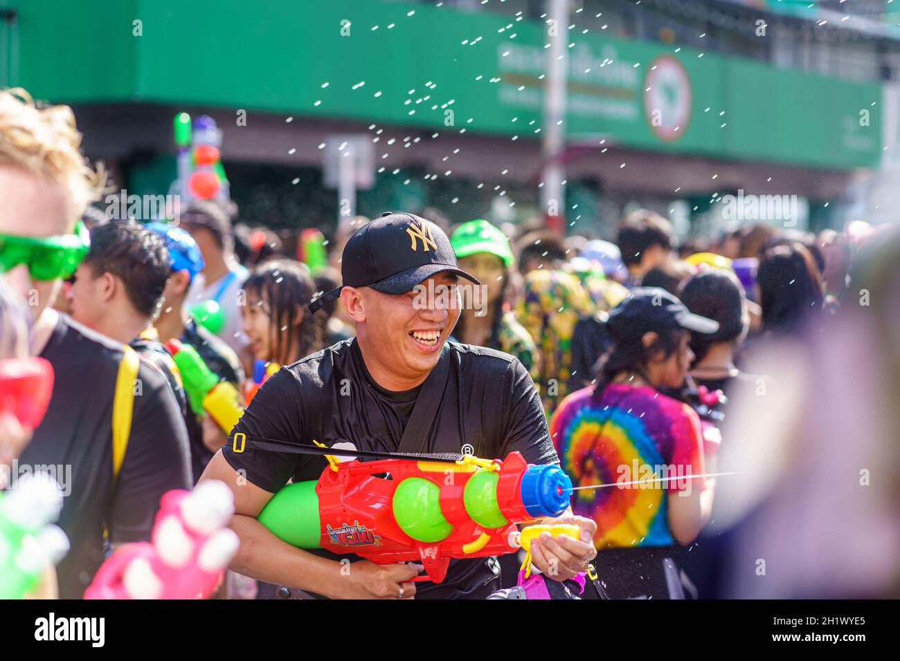 Siam Square, Bangkok, Thailand - APR 13, 2019: short action of people joins celebrations of the Thai New Year or Songkran in Siam Square. Stock Photo