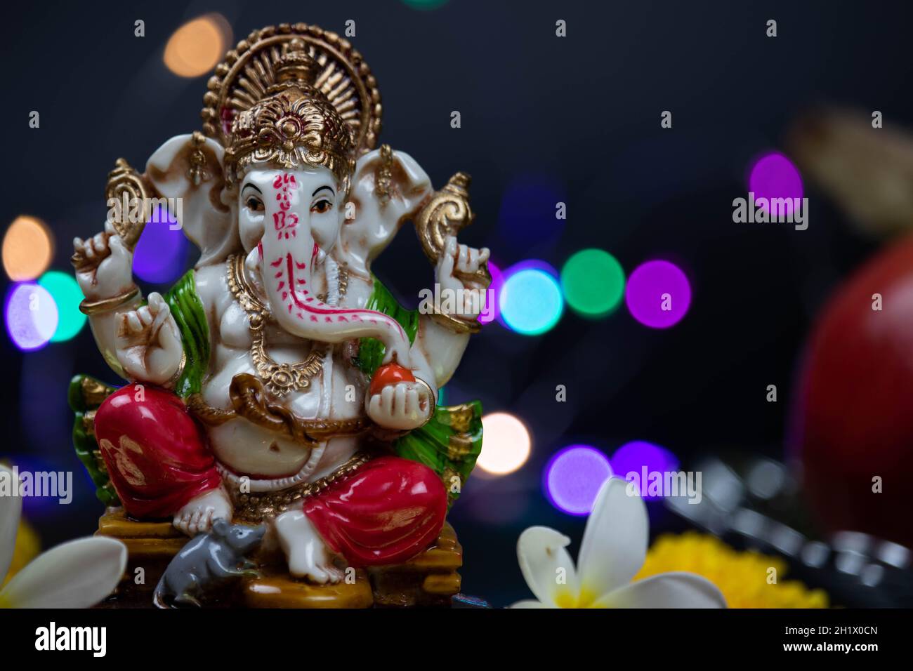 Closeup Of Hindu God Ganesha Ganpati Bappa Morya In Sitting Pose On A  Colorful Bokeh Effect Black Background. For Prayers On Diwali Puja New Year  Deep Stock Photo - Alamy