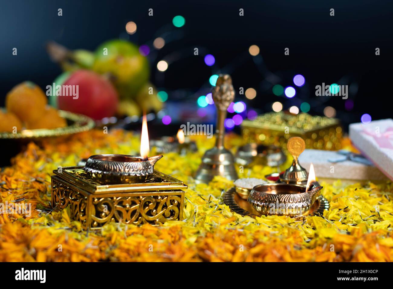 Golden Brass Diya Deep Burning On Flower Bed Decoration And Bokeh Effect For Diwali Puja New Year Deepawali Or Shubh Deepavali Navratra Pooja Festival Stock Photo