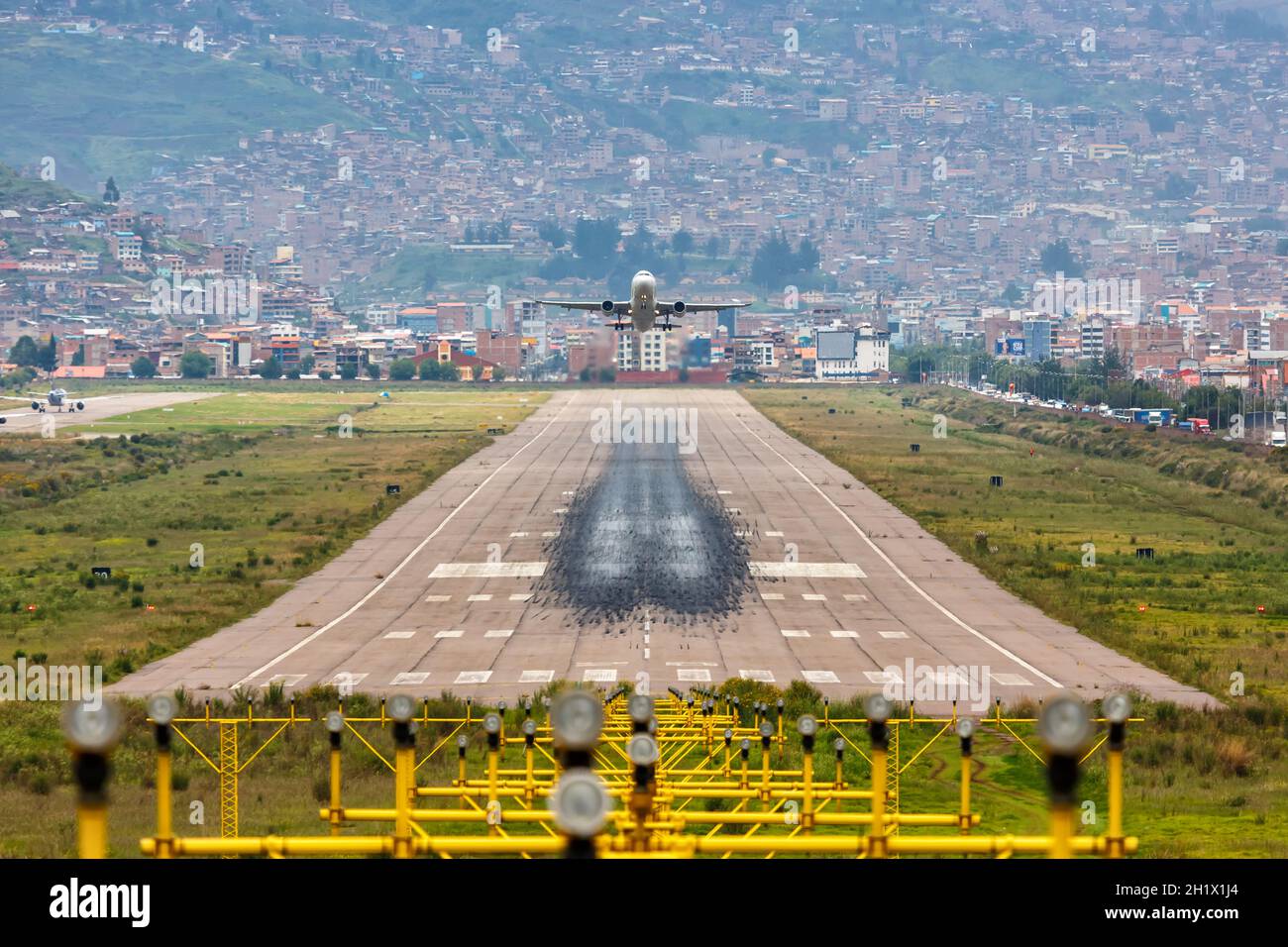 Cuzco, Peru - February 2, 2019: Airplane and runway at Cuzco Airport (CUZ) in Peru. Stock Photo