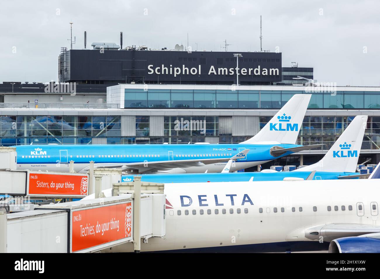 Amsterdam, Netherlands - May 21, 2021: Airplanes at Amsterdam Schiphol airport (AMS) in the Netherlands. Stock Photo
